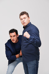 Studio portrait of two male friends 