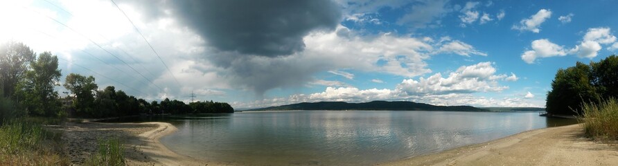 Fototapeta premium lake close to forest in summer season in sunny day