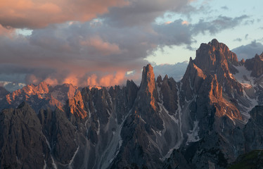 Mountain landscape in the European Dolomite Alps underneath the Three Peaks with alpenglow during...