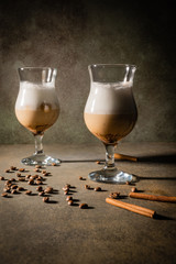 Homemade dalgona coffee. Trendy fluffy creamy whipped drink made by instant coffee, sugar and milk. Vertical orientation