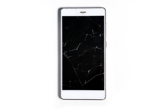 A modern mobile touch smartphone with a broken glass screen isolated on a white background. Service, repair and technological concept. Copy space for text.