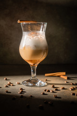 Homemade dalgona coffee. Trendy fluffy creamy whipped drink made by instant coffee, sugar and milk. Vertical orientation