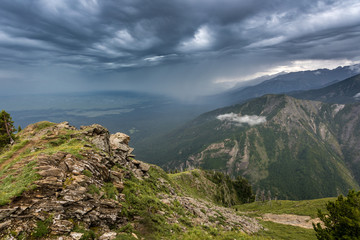 wooden fence in the valley with mountains, Arshan, Tunka valley