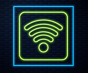 Glowing neon line Wi-Fi wireless internet network symbol icon isolated on brick wall background. Vector Illustration