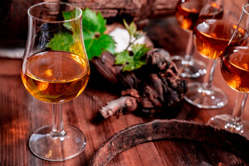 Tasting of aged french cognac brandy in old cellars of cognac-producing regions Champagne or Bois, France