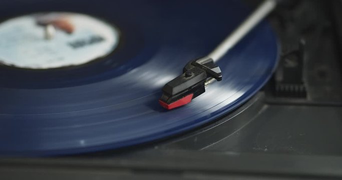 Detail of a vinyl record on a vintage record player