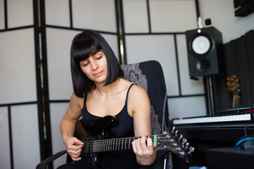 Fototapeta na wymiar woman learning guitar