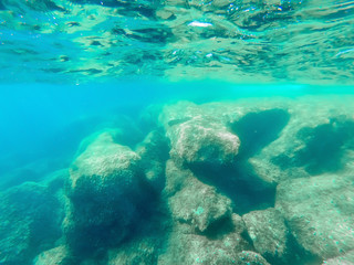 Underwater view of Alghero rocky shore in summer