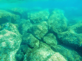 Turquiose water and rocks in Alghero shore