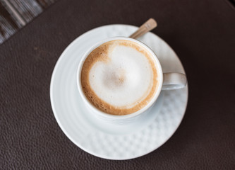 White cup with drink. Tasty coffee with milk