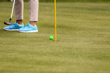 Player a during a golf game during a hit