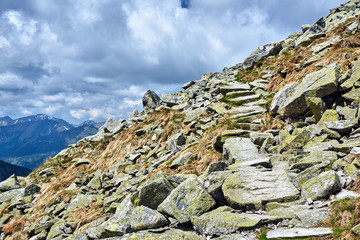 Hiking trail among the rocky peaks of the Tatra Mountains in Poland.