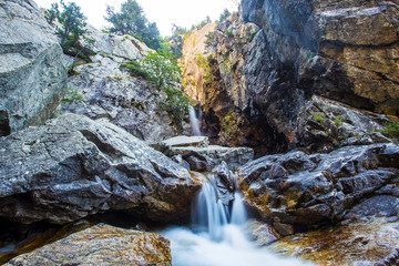 Beautiful waterfall of Baños de Panticosa in the Aragonese Pyrenees. Spain, vertical photo