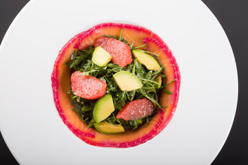 Smoked salmon salad with arugula, grapefruit and avocado