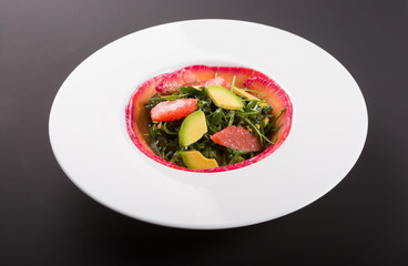 Smoked salmon salad with arugula, grapefruit and avocado
