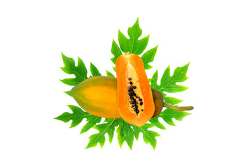 whole and half ripe papaya with green leaf isolated on white background