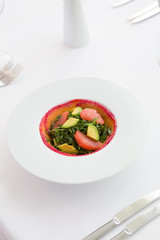 Smoked salmon salad with arugula, grapefruit and avocado
