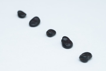 Close up black beans isolated on white background