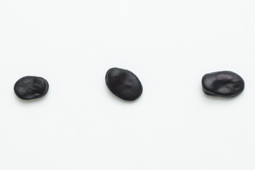Close up black beans isolated on white background