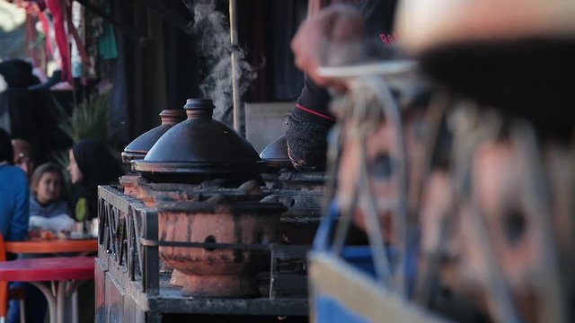 Traditional moroccan Tajine food being cooked in street market at Asni, in the moroccan Atlas.
Mid angle, small depth of field, slow motion, parallax movement, HD
