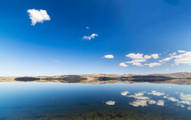 Obraz na płótnie Canvas Panoramic view of Vlasina lake at early spring.