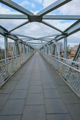 Metal truss bridge isolated. Vertical image. Copy space.