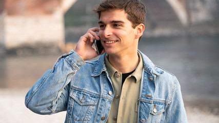 fashion man who uses smartphone by calling