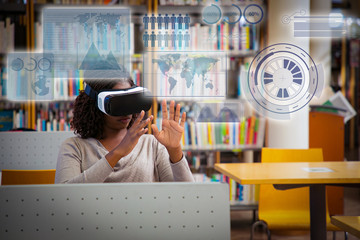 African American using VR simulator for virtual data analysis. Woman in virtual reality headsets sitting at desks and touching air. VR gadgets in education concept