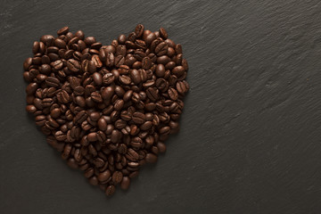 Heart of freshly roasted coffee beans. Coffee lovers.