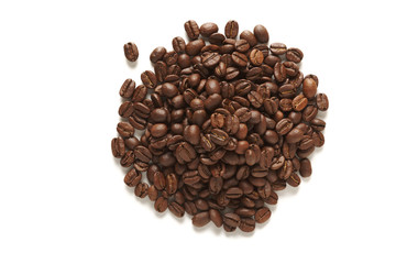 Pile of freshly roasted coffee beans on a white background