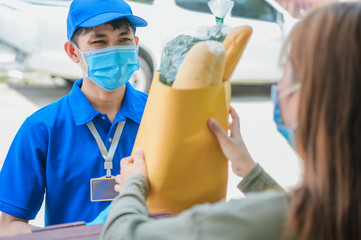 Woman hand accepting a delivery of boxes from deliveryman