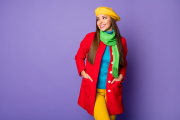 Photo of attractive pretty lady look side empty space shopping prices banner advert wear yellow beret blue turtleneck green scarf red long coat pants isolated purple color background