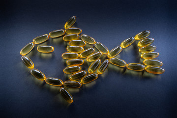 Fish oil capsules in fish shape