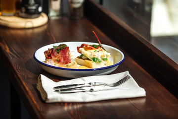Closeup on bruschetta toasts with bacon vegetables