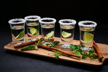 Vodka in shot glasses, herbal lemon