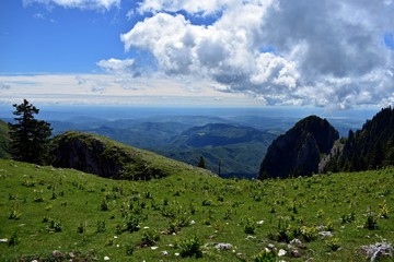 white clouds at high altitude in the rocky mountains in spring season