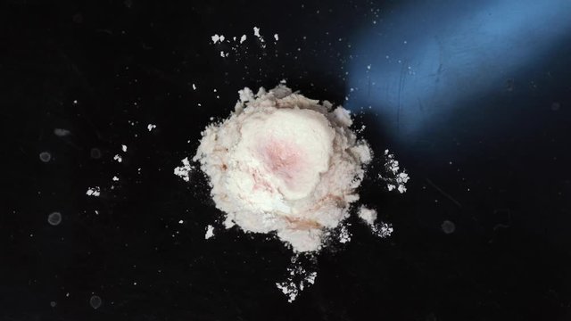 A pill dissolving in water in macro