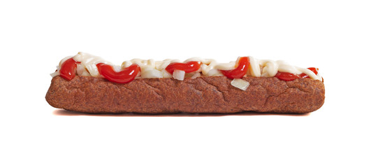 One frikadel with ketchup, mayonnaise on chopped onions, a Dutch fast food snack called 'frikadel...