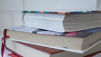 Education. A stack of books on a white background.