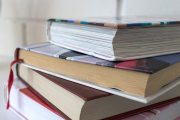 Education. A stack of books on a white background.