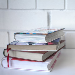 Education. A stack of books on a white background.