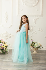 Fototapeta premium Little girl child in a fashionable dress