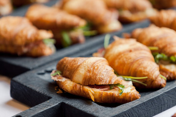 Fresh croissant on wooden table