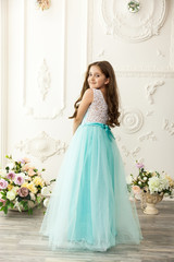 Fototapeta premium Little girl child in a fashionable dress
