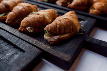 Fresh croissant on wooden table
