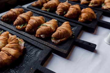 Fresh croissant on wooden table