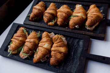 Fresh croissant on wooden table