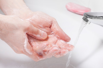 Fototapeta premium Hand washing with soap. Concept of hygiene, healthy lifestyle, protection from bacteria.