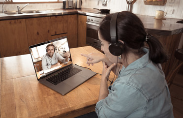 Woman with laptop in virtual meeting video conference Working from home due coronavirus lockdown