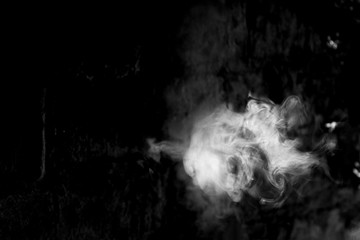 White smoke isolated on a black background. smoke image is like a ghost